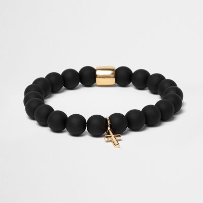 Black bauble cross bracelet